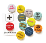 A group of colorful pinback buttons dealing with different aspects of chronic illness. Migraine Day, Medical Mystery, Fatigue Fiasco etc.