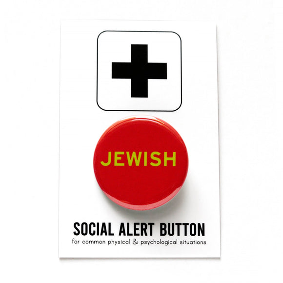 Round red pinback button reads JEWISh in light green text, on SOCIAL ALERT BUTTON backing card.