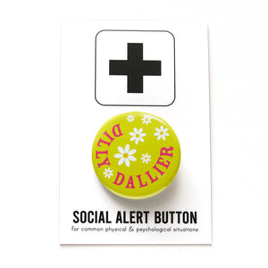 Round, lime green pinback button that reads DILLY DALLIER in deep pink, in a half circle around the edge. The rest of the button has little white daisies with yellow centers.  Button is on a Social Alert Button branded backing card.