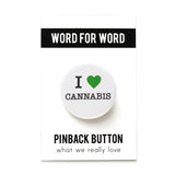 Round white button reads I LOVE CANNABIS. Green heart symbol represents love, remaining text is in black. Button is on a Word For Word branded backing card.