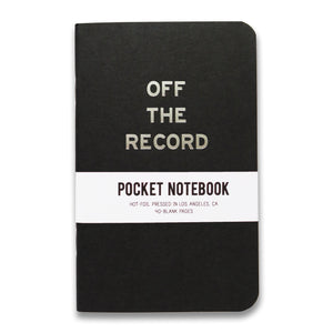 Black vertical pocket notebook with rounded corners. OFF THE RECORD imprinted in silver foil on the front. Wrap around info band reads Pocket Notebook, Hot Foil Pressed In Los Angeles, CA, 40 blank pages 