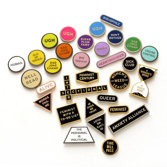 Collection of Enamel pins by Word for Word Factory.  Feminist, Weed, Queer, Social Justice, and Disability Communities