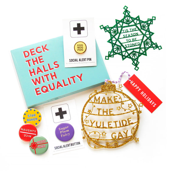 A holiday cluster of greeting cards, ornaments and pinback buttons in bright holiday colors with sayings like Deck The HallsWith Equality & Star Baker.