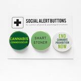 Three round pinback buttons in different shades of green, lined up on a SOCIAL ALERT BUTTONS backing card. Reading left to right: Cannabis Connoisseur, Smart Stoner, End Cannabis Prohibition Now!