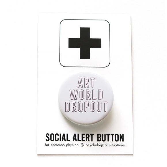 Round white pinback button that reads ART WORLD DROPOUT in hollow black text. Button is on a Social Alert Button backing card. 