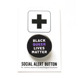 Round 1.25" black pinback button that reads BLACK QUEER LIVES MATTER in white & purple text. Button is on a Social alert button backing card.