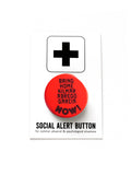 A round red-orange 1.25" pinback button that reads BRING HOME KILMAR ABREGO GARCIA NOW!  Button is pinned to a Social Alert Button backing card.