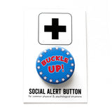 A round blue button with white stars around the edge, reading Buckle Up! in red text. Badge is on a Social Alert Button backing card. This is a button for the 2024 Election in the style of theSchool House Rock Bill Cartoon.