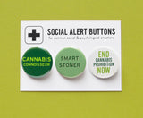 Three round pinback buttons in different shades of green, lined up on a SOCIAL ALERT BUTTONS backing card. Reading left to right: Cannabis Connoisseur, Smart Stoner, End Cannabis Prohibition Now!