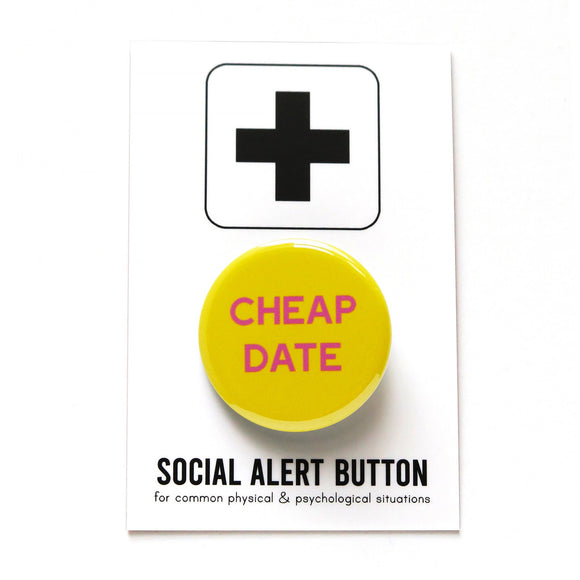 Round bright yellow pinback button that reads CHEAP DATE in pink text. Button is on a Social Alert Button backing card.