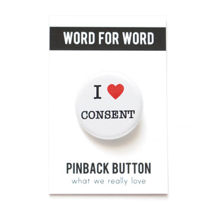 A round white button that reads I LOVE CONSENT, love being a red heart. On a WORD FOR WORD branded backing card, What We Really Love