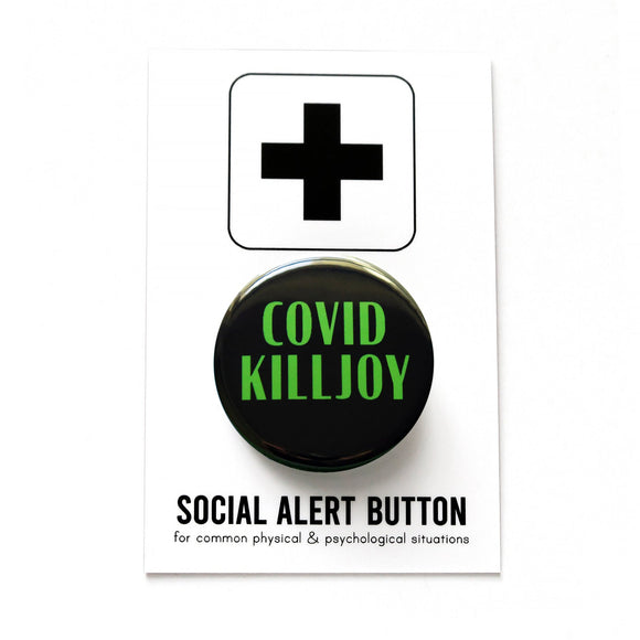 Round black pinback button with green text that reads COVID KILLJOY. Button is on a Social Alert Button backing card.