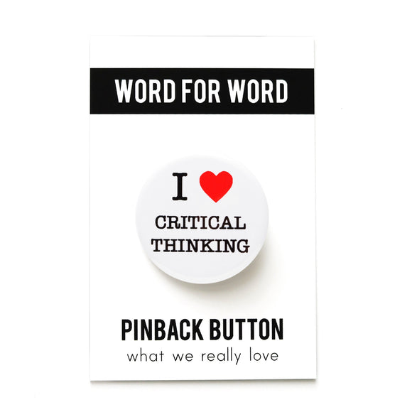 Round white pinback button that reads I LOVE CRITICAL THINKING, love being a red heart. Pinned to a Word For Word branded backing card, What We Really Love.