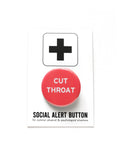 Round pinback button that says CUT THROAT. White text on a dark coral background. Button is on a Social Alert Button backing card.