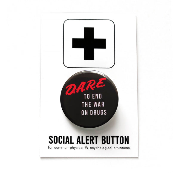 Round black pinback button that reads DARE to End The War On Drugs in red and white text. Button is pinned to a Social Alert Button backing card.