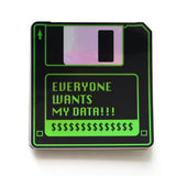 A black & green holographic sticker that look like a 1990's little hard floppy disc that reads EVERYONE WANTS MY DATA !!! with a strip of dollar signs where a label would be.