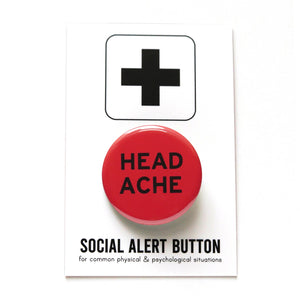 A round red pinback button that reads HEADACHE in black text on two lines. Badge is on a Social Alert Button backing card.