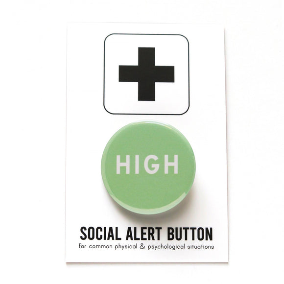 Round pinback button that says HIGH. White text on a mint green background. Badge on Social Alert Button backing card.