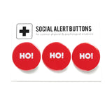 3 round red pinback buttons lined up on a SOCIAL ALERT BUTTONS backing card. Reading left to right: Ho! Ho! Ho! 