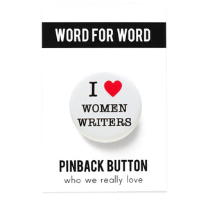 A round white pinback button that reads I LOVE WOMEN WRITERS with love being a red heart. Pinned to a Word For Word branded backing card, Who We Really Love
