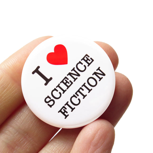 Round white pinback button that reads I LOVE SCIENCE FICTION. 