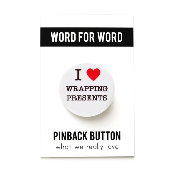 Round, white pinback button that says I LOVE WRAPPING PRESENTS in classic black text with 