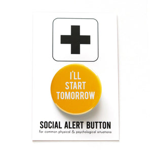 A round rich mustard yellow pinback button that reads I'LL START TOMORROW. Badge is pinned to a Social Alert Button backing card.