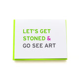 Smart Stoner Greeting Card, that reads LET'S GET STONED & GO SEE ART. White card with green, pink and black san serif text. Set with a neon green envelope.
