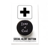 Black round pinback button that reads LUMP OF COAL in white old fashioned font. Button is on a Social Alert Button backing card.