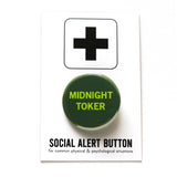 Round pinback button that says MIDNIGHT TOKER. Light green text on a dark green background. Button is pinned to a Social Alert Button backing card