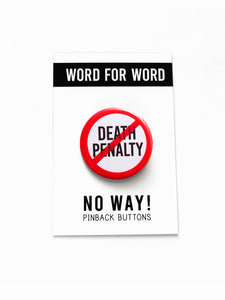 A round white button that reads NO DEATH PENALTY in black text with a red circle and slash to indicate being against the death penalty. Button is held in a hand.