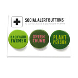 Three round pinback buttons in different shades of green, lined up on a SOCIAL ALERT BUTTONS backing card. Reading left to right: Backyard Farmer, Green Thumb, Plant Person.