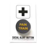 Round gray pinback button that reads PAIN TRAIN in yellow text. Button is on a Social Alert Button backing card.