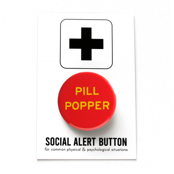 Round red pinback button that reads PILL POPPER in yellow text. Button is on a Social Alert Button backing card.