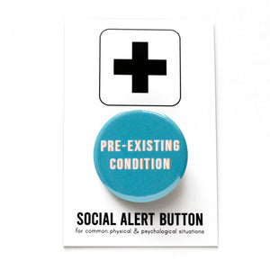 Round pinback button that says PRE-EXISTING CONDITION. White text on a blue background. Button is pinned to a Social Alert Button backing card.