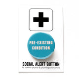 Round pinback button that says PRE-EXISTING CONDITION. White text on a blue background. Button is pinned to a Social Alert Button backing card.