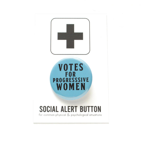 Light blue round pinback button that reads VOTES FOR PROGRESSIVE WOMEN! in black text. Button is a Social Alert Button backing card.