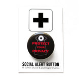 Round black pinback button that reads PROTECT YOUR PRIVACY in red text with a big brother overseer eye  overlooking the text. Button is on a Social Alert Button backing card.