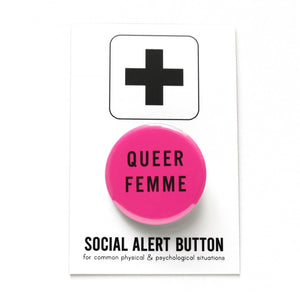 Magenta pink round pinback button that reads QUEER FEMME in black san serif text. Badge is on a Social Alert Button backing card. 
