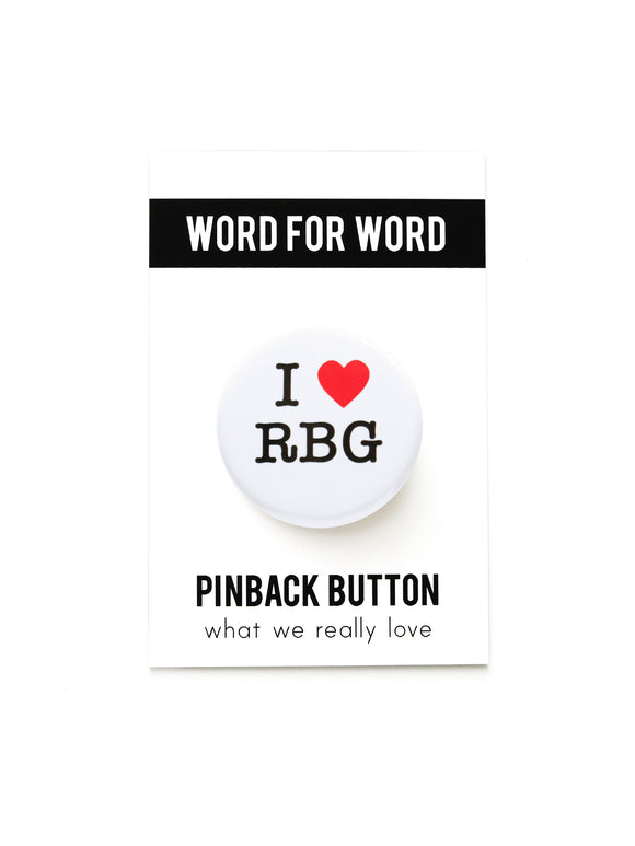 Round white pinback button that reads I LOVE RBG with love being a red heart. On a Word For Word branded backing card. 
