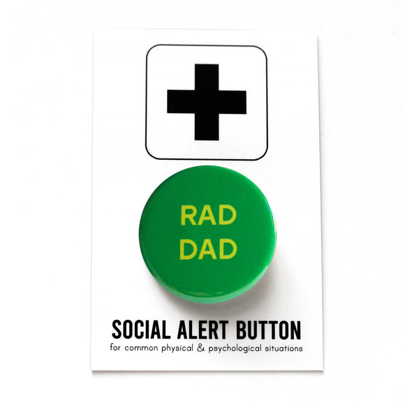 Round Keely green pinback button with yellow text that reads RAD DAD. Pinned to a Social Alert Button backing card.