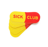 Stack of flared stickers. Capsule shaped stickers that read SICK CLUB.  The background is like a yellow and red capsule pill.