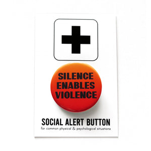 A round pinback button with an orange-red background, that reads SILENCE ENABLES VIOLENCE in black text. Button is held in a hand.