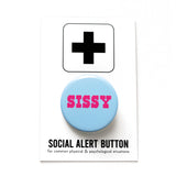 Round pinback button with a pale blue-teal background which reads SISSY in a bright pink chunky text.  On a white backing card, black plus sign at the top. Below reads: Social Alert Button, with tiny text beneath it which says, for common physical & psychological situations