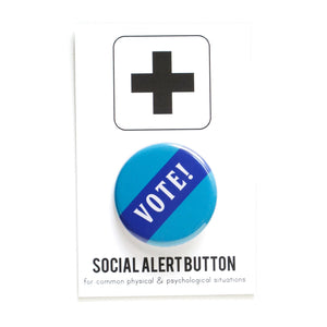 Blue round pinback button that reads VOTE! in white across a navy blue diagonal strip. Button is a Social Alert Button backing card.