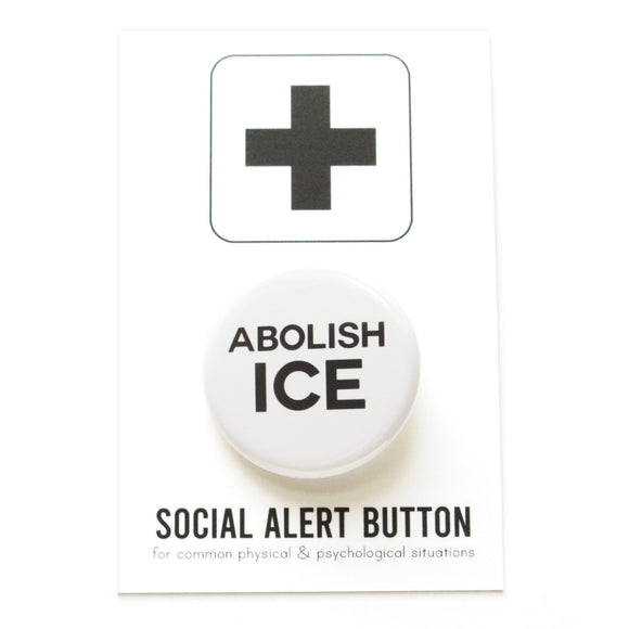 Round pinback button that says ABOLISH ICE. Black text on a white background. The button is pinned to a Social Alert Button backing card.