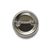 back of a metal pinback button