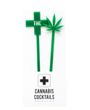 Two green acrylic, laser cut drink stirrers.  One is topped with a green cross that says THC in the middle, the other is topped with a pot leaf.  
