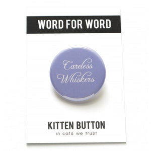 Round pinback button that says CARELESS WHISKERS. White text on a pale lavender background.