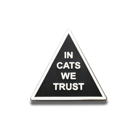 Triangle shaped hard enamel pin that says IN CATS WE TRUST.  Silver text and outline on a black enamel background.